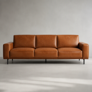 Front view of the Atelier cognac leather three-seat sofa
