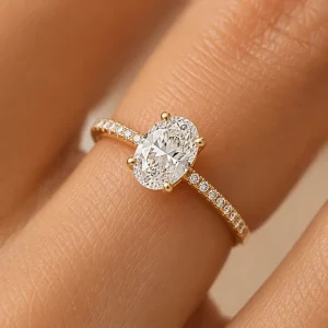 Close-up of the Aurora oval diamond ring on a finger