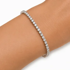 Close-up of the Celeste diamond tennis bracelet worn on a wrist against a white background